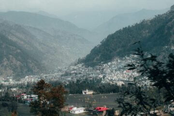 a view of a town in the mountains