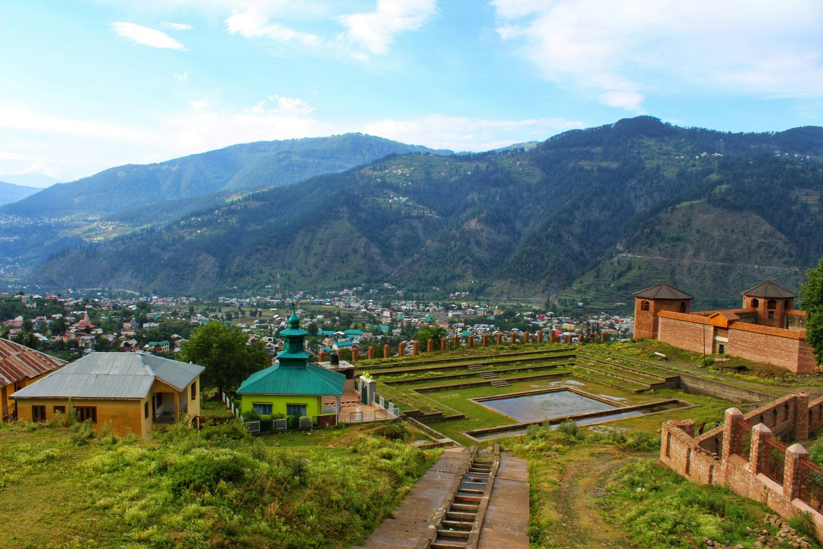 aerial view of city near mountain during daytime