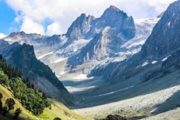 green and gray mountains under white clouds during daytime