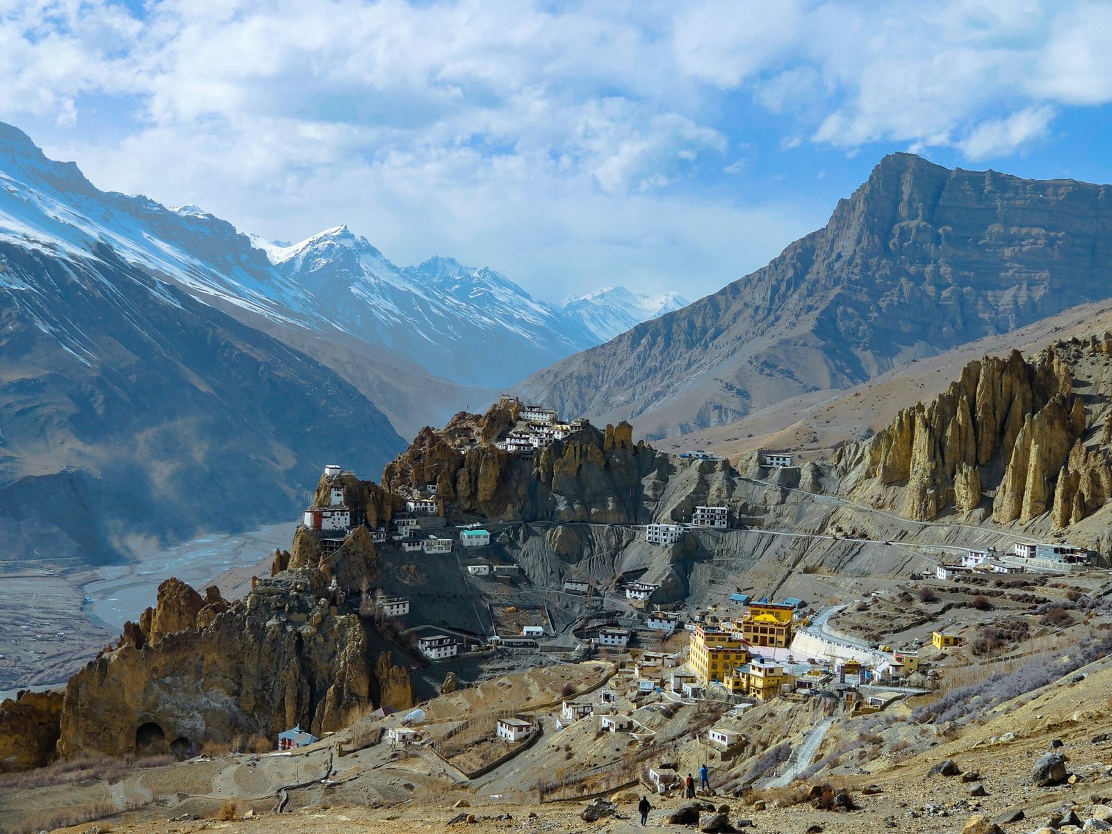 white and brown houses on mountain under blue sky during daytime